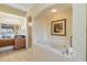Double vanity, walk-in shower, and a relaxing bathtub at 8101 Resort Village Dr, Orlando, FL 32821