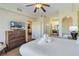 King-size bed, dresser, and views into the bathroom and kitchen at 8101 Resort Village Dr, Orlando, FL 32821
