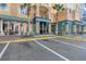Building exterior showing nearby businesses at 8101 Resort Village Dr, Orlando, FL 32821