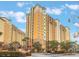 Exterior view of yellow building, part of a resort community at 8101 Resort Village Dr, Orlando, FL 32821