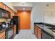 Modern kitchen with black appliances and granite countertops at 8101 Resort Village Dr, Orlando, FL 32821