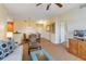 Living room with seating area and view of dining area at 8101 Resort Village Dr, Orlando, FL 32821