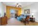 Living room with sofa, chairs, and access to balcony at 8101 Resort Village Dr, Orlando, FL 32821