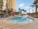 Relaxing resort pool with lounge chairs and a pirate ship water feature at 8101 Resort Village Dr, Orlando, FL 32821