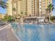 Resort pool with lounge chairs and a view of the building at 8101 Resort Village Dr, Orlando, FL 32821