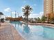 Long resort pool with pirate ship water feature and lounge chairs at 8101 Resort Village Dr, Orlando, FL 32821