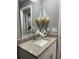 Bathroom with granite vanity, white cabinets, and fluffy decor at 943 Derbyshire Dr, Kissimmee, FL 34758