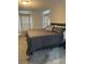 Bright bedroom featuring a large king-size bed and ample natural light at 943 Derbyshire Dr, Kissimmee, FL 34758