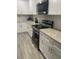 Kitchen with white cabinets, granite countertops, and stainless steel appliances at 943 Derbyshire Dr, Kissimmee, FL 34758
