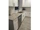 Kitchen with white shaker cabinets, granite countertops, and stainless steel sink at 943 Derbyshire Dr, Kissimmee, FL 34758