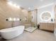 Modern bathroom featuring a freestanding tub, glass shower, and vanity at 9697 Bryanston Dr, Orlando, FL 32827