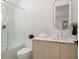 Modern bathroom featuring stylish fixtures, a spacious tub, and a unique mirror enhance this spa-like retreat at 9697 Bryanston Dr, Orlando, FL 32827