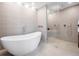 Luxury bathroom with soaking tub and large shower at 9697 Bryanston Dr, Orlando, FL 32827