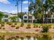 Rear view of a beautiful house overlooking a lake at 9697 Bryanston Dr, Orlando, FL 32827