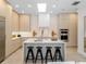 Bright modern kitchen with a large island, sleek cabinetry, and stainless steel appliances at 9697 Bryanston Dr, Orlando, FL 32827