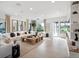 Open living space with sectional sofa and large windows at 9697 Bryanston Dr, Orlando, FL 32827