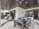 Outdoor patio with ceiling fans and stylish furniture offer a comfortable setting for entertaining and relaxation at 9697 Bryanston Dr, Orlando, FL 32827