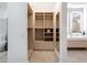 Bright walk-in closet with ample shelving and drawers at 9697 Bryanston Dr, Orlando, FL 32827