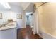 Clean bathroom with double vanity and a bathtub at 5356 Diplomat Ct # 107, Kissimmee, FL 34746
