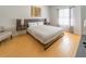 Spacious bedroom with a king-size bed and hardwood floors at 5356 Diplomat Ct # 107, Kissimmee, FL 34746