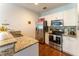 Modern kitchen with granite countertops and stainless steel appliances at 5356 Diplomat Ct # 107, Kissimmee, FL 34746