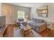 Cozy living room featuring a comfy couch and hardwood floors at 5356 Diplomat Ct # 107, Kissimmee, FL 34746