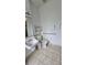 Accessible bathroom with grab bars and a roll-in shower at 1013 Park Ridge Cir, Kissimmee, FL 34746