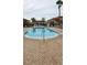 Community pool with lounge chairs at 1013 Park Ridge Cir, Kissimmee, FL 34746