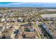 Aerial view of a large community of houses and a lake at 10175 Peebles St, Orlando, FL 32827