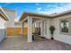 Covered patio with seating area and string lights, next to a fence at 10175 Peebles St, Orlando, FL 32827