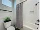 Clean bathroom with shower/tub combo, toilet, and modern fixtures at 10175 Peebles St, Orlando, FL 32827