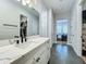 Bathroom with single vanity, marble countertop, and view of bedroom at 10175 Peebles St, Orlando, FL 32827