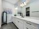 Double vanity bathroom with marble countertop and modern lighting at 10175 Peebles St, Orlando, FL 32827