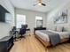 Spacious bedroom with a king-size bed and a workspace at 10175 Peebles St, Orlando, FL 32827