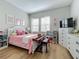 Charming bedroom with pink accents and plenty of storage at 10175 Peebles St, Orlando, FL 32827