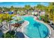 Resort-style pool with palm trees and lounge chairs at 10175 Peebles St, Orlando, FL 32827