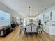 Bright dining room with hardwood floors and modern chandelier at 10175 Peebles St, Orlando, FL 32827