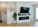 Living room fireplace with shiplap wall and built-in media console at 10175 Peebles St, Orlando, FL 32827