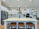 Spacious kitchen island with quartz countertop and breakfast bar seating at 10175 Peebles St, Orlando, FL 32827