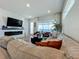 Bright living room featuring a comfortable sectional sofa and a modern fireplace at 10175 Peebles St, Orlando, FL 32827