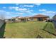 Large backyard with grassy area and privacy fence at 125 Silver Maple Rd Rd, Groveland, FL 34736