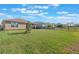 Spacious backyard with a large lawn and privacy fence at 125 Silver Maple Rd Rd, Groveland, FL 34736