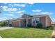 House exterior featuring a stone accent and garage at 125 Silver Maple Rd, Groveland, FL 34736