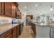 Modern kitchen with wood cabinets and granite countertops at 125 Silver Maple Rd, Groveland, FL 34736