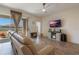 Living room featuring a large TV and sliding glass doors at 125 Silver Maple Rd, Groveland, FL 34736