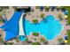 Overhead view of resort-style pool with blue shade sail at 125 Silver Maple Rd Rd, Groveland, FL 34736