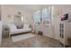 Cozy sitting area with a daybed, built-in shelving, and a barn door at 125 Silver Maple Rd, Groveland, FL 34736