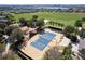 Aerial view of tennis courts and surrounding landscape at 125 Silver Maple Rd, Groveland, FL 34736