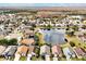 Wide aerial view of neighborhood near a tranquil lake at 12821 Gettysburg Cir, Orlando, FL 32837