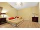 King-size bedroom with wood floors and a ceiling fan at 12821 Gettysburg Cir, Orlando, FL 32837